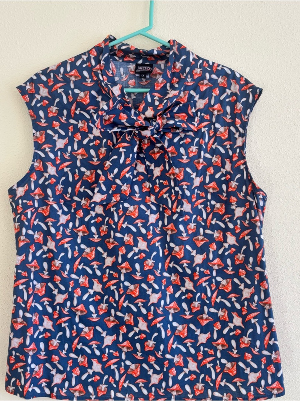 Retrolicious Navy Sleeveless Bow Neck Top with Red & White Mushroom Print